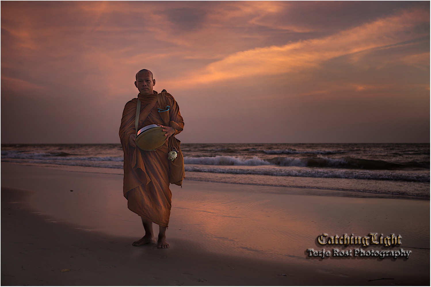 Buddhist monk in the sunrise